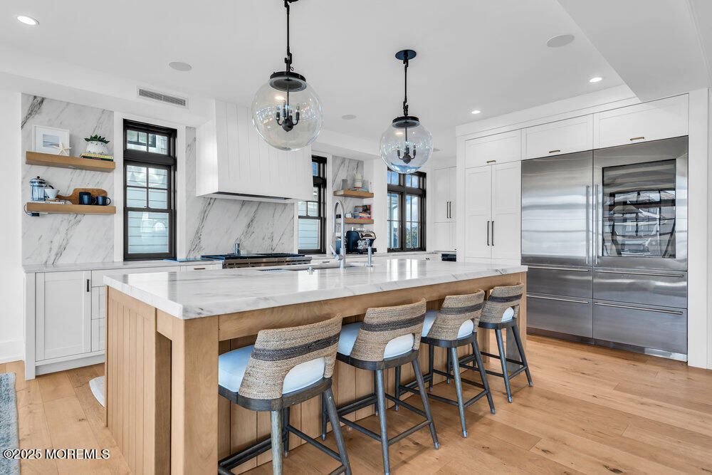 Interior, Kitchen, Marble Walls, Pendant Lights, Recessed Lighting, Stainless Steel Appliances, Wood Texture Flooring