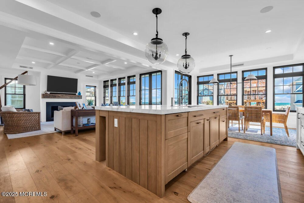 Dining room, Fireplace, Interior, Living room, Pendant Lights, Recessed Lighting, Wood Texture Flooring