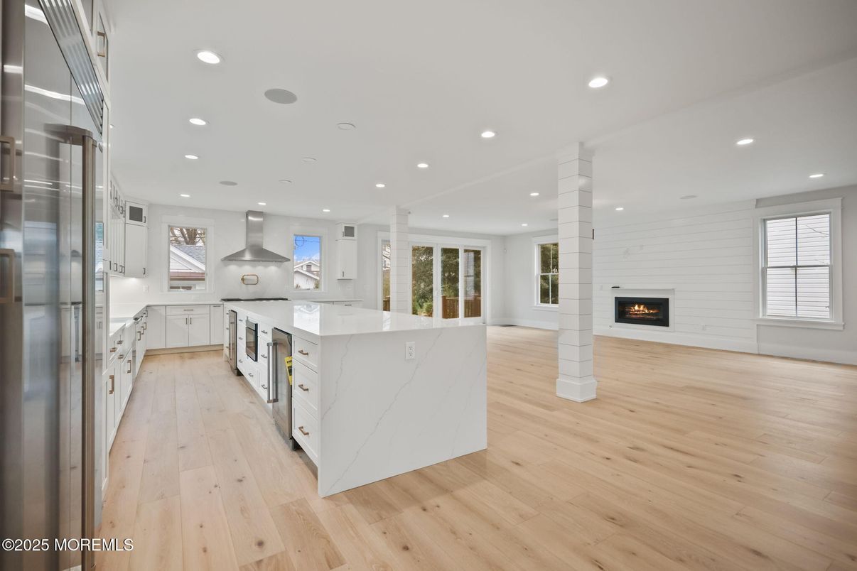 Fireplace, Interior, Kitchen, Pendant Lights, Recessed Lighting, Stainless Steel Appliances, Wood Texture Flooring