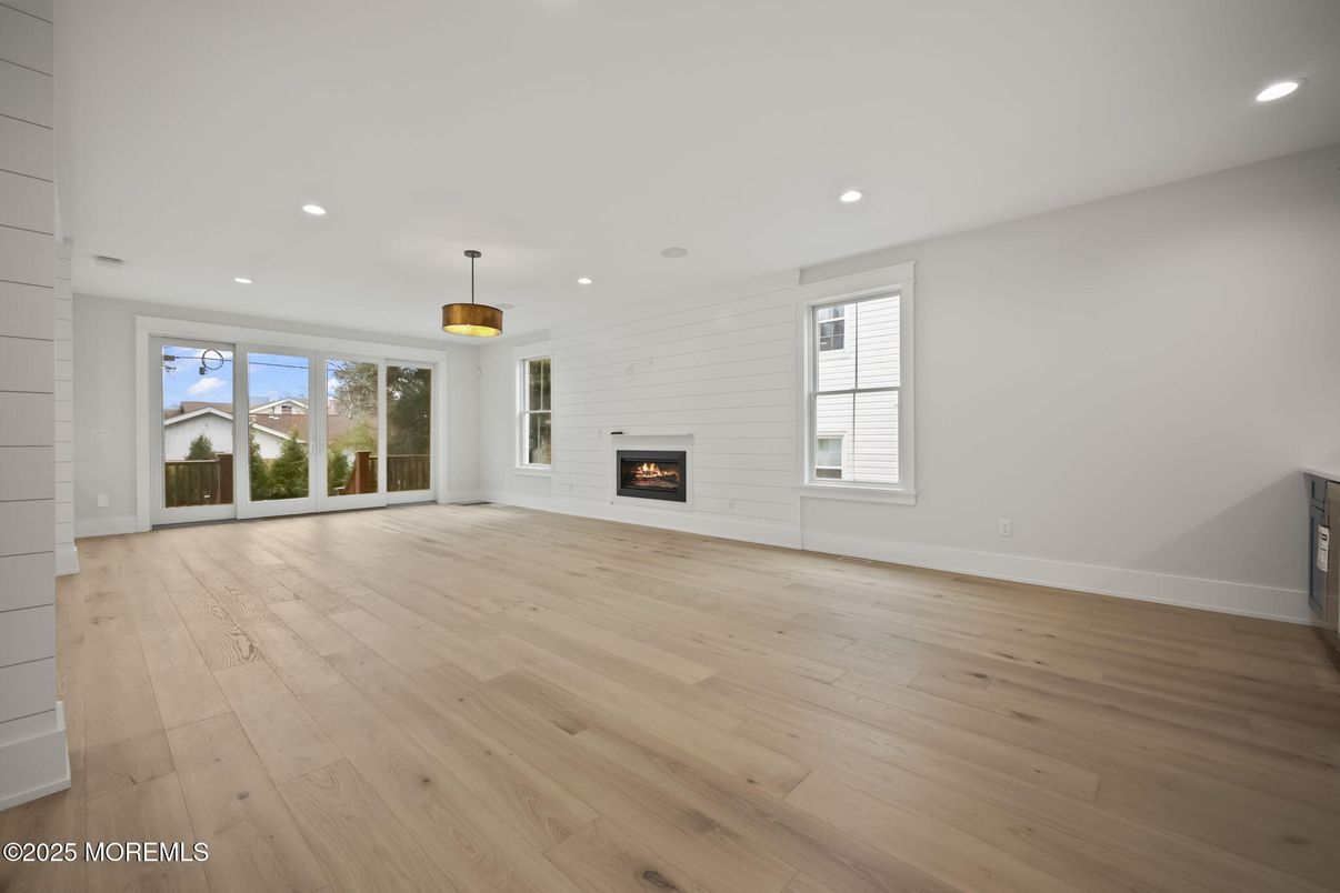 Empty room, Fireplace, Interior, Pendant Lights, Recessed Lighting, Wood Texture Flooring
