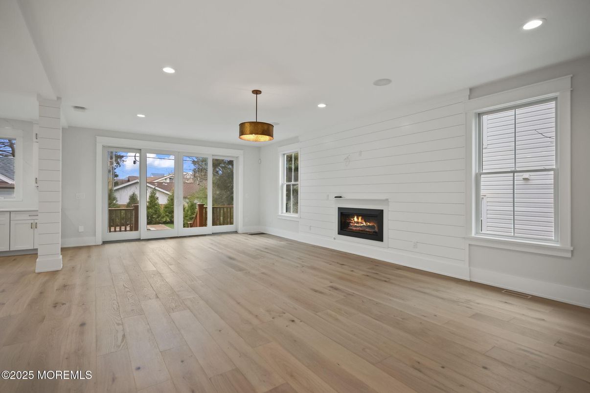 Empty room, Fireplace, Interior, Pendant Lights, Recessed Lighting, Wood Texture Flooring
