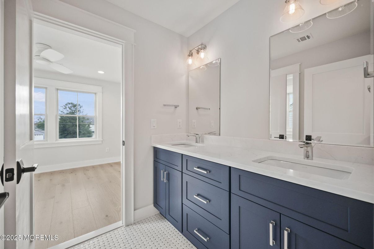 Bathroom, Dual Sink Vanities, Interior, Recessed Lighting, Wood Texture Flooring
