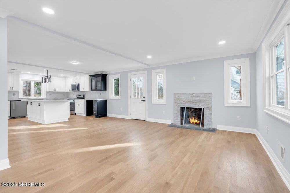 Empty room, Fireplace, Interior, Kitchen, Pendant Lights, Recessed Lighting, Wood Texture Flooring