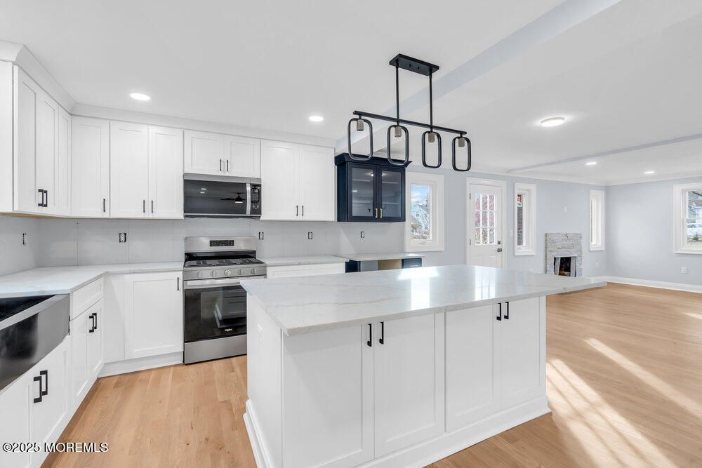 Fireplace, Interior, Kitchen, Pendant Lights, Recessed Lighting, Stainless Steel Appliances, Wood Texture Flooring