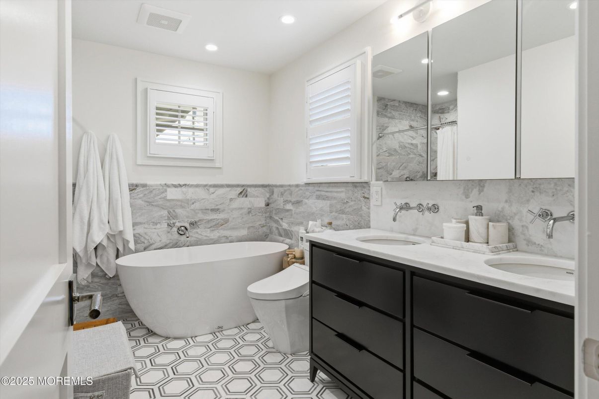 Bathroom, Dual Sink Vanities, Free Standing Baths, Interior, Marble Walls, Recessed Lighting