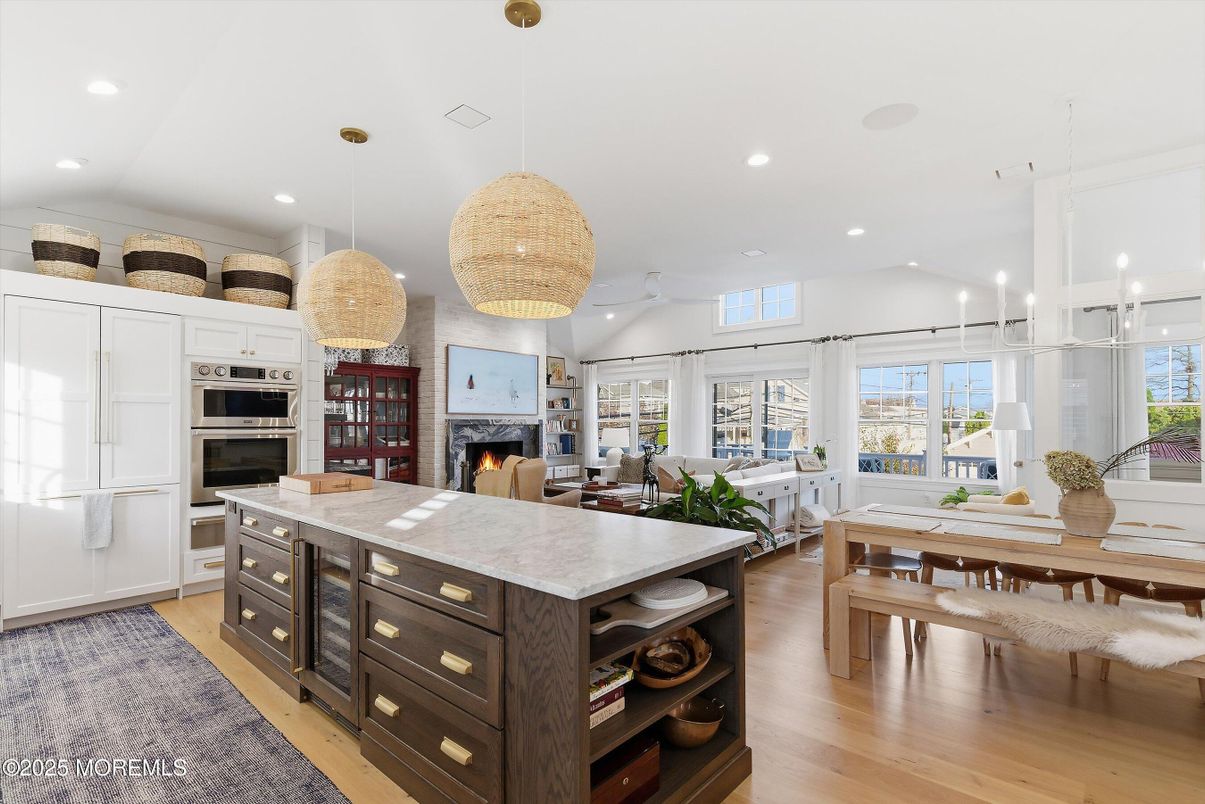 Dining room, Fireplace, Interior, Kitchen, Living room, Pendant Lights, Recessed Lighting, Stainless Steel Appliances, Wood Texture Flooring