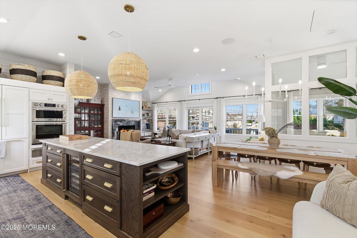 Dining room, Fireplace, Interior, Kitchen, Living room, Pendant Lights, Recessed Lighting, Stainless Steel Appliances, Wood Texture Flooring