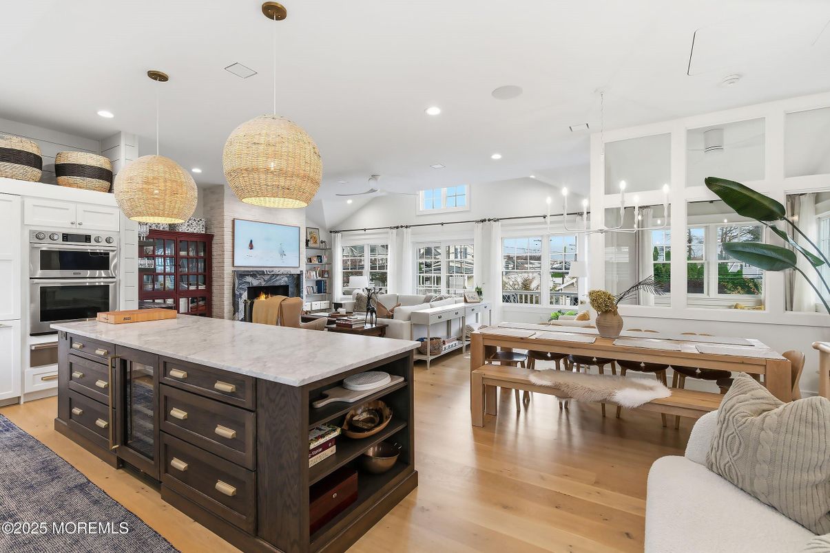 Dining room, Fireplace, Interior, Kitchen, Living room, Pendant Lights, Recessed Lighting, Stainless Steel Appliances, Wood Texture Flooring