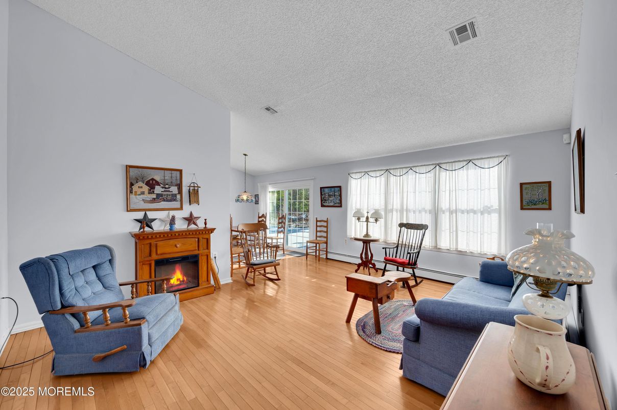 Dining room, Fireplace, Interior, Living room, Pendant Lights, Wood Texture Flooring