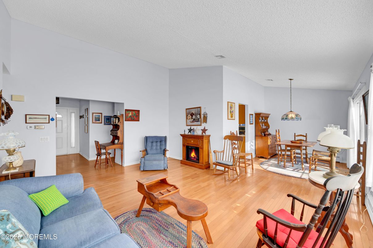 Dining room, Fireplace, Interior, Living room, Pendant Lights, Wood Texture Flooring