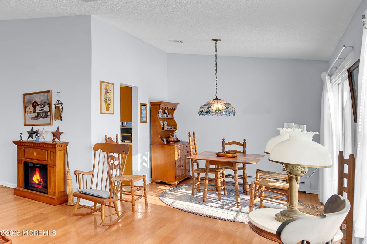 Dining room, Fireplace, Interior, Pendant Lights, Wood Texture Flooring