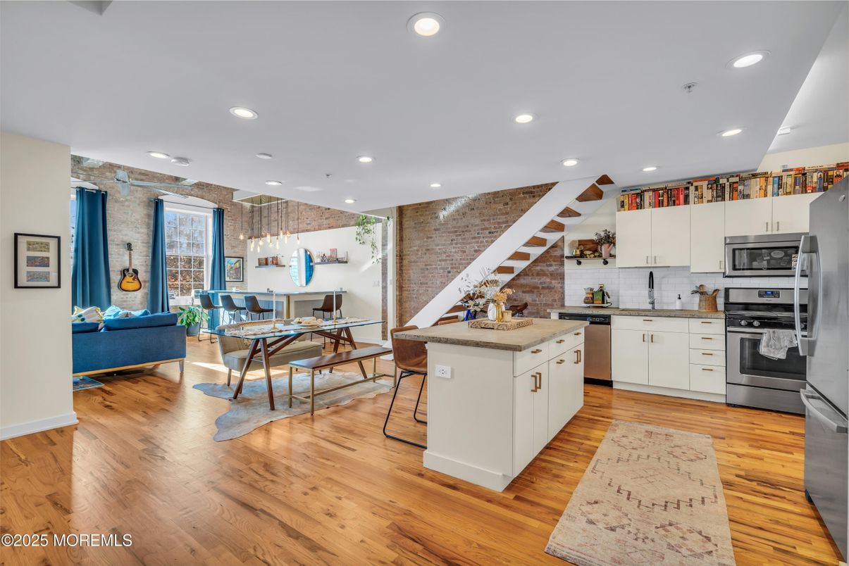 Dining room, Interior, Kitchen, Living room, Pendant Lights, Recessed Lighting, Stainless Steel Appliances, Wood Texture Flooring