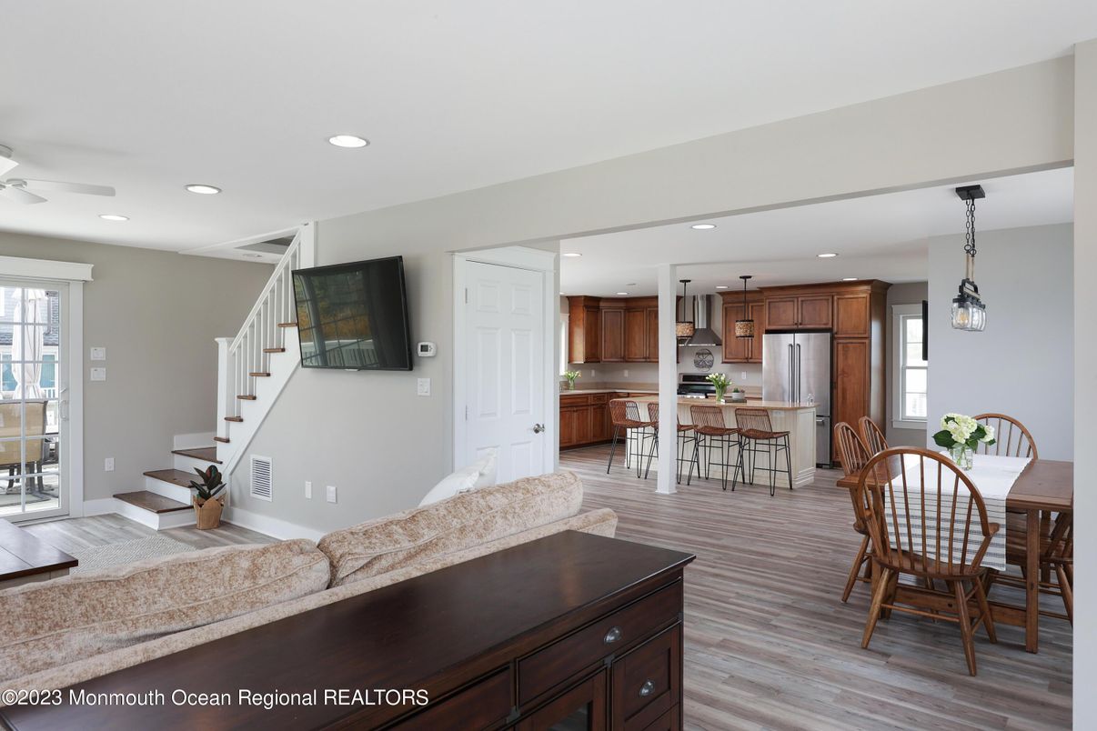 Dining room, Interior, Kitchen, Pendant Lights, Recessed Lighting, Stainless Steel Appliances, Wood Texture Flooring