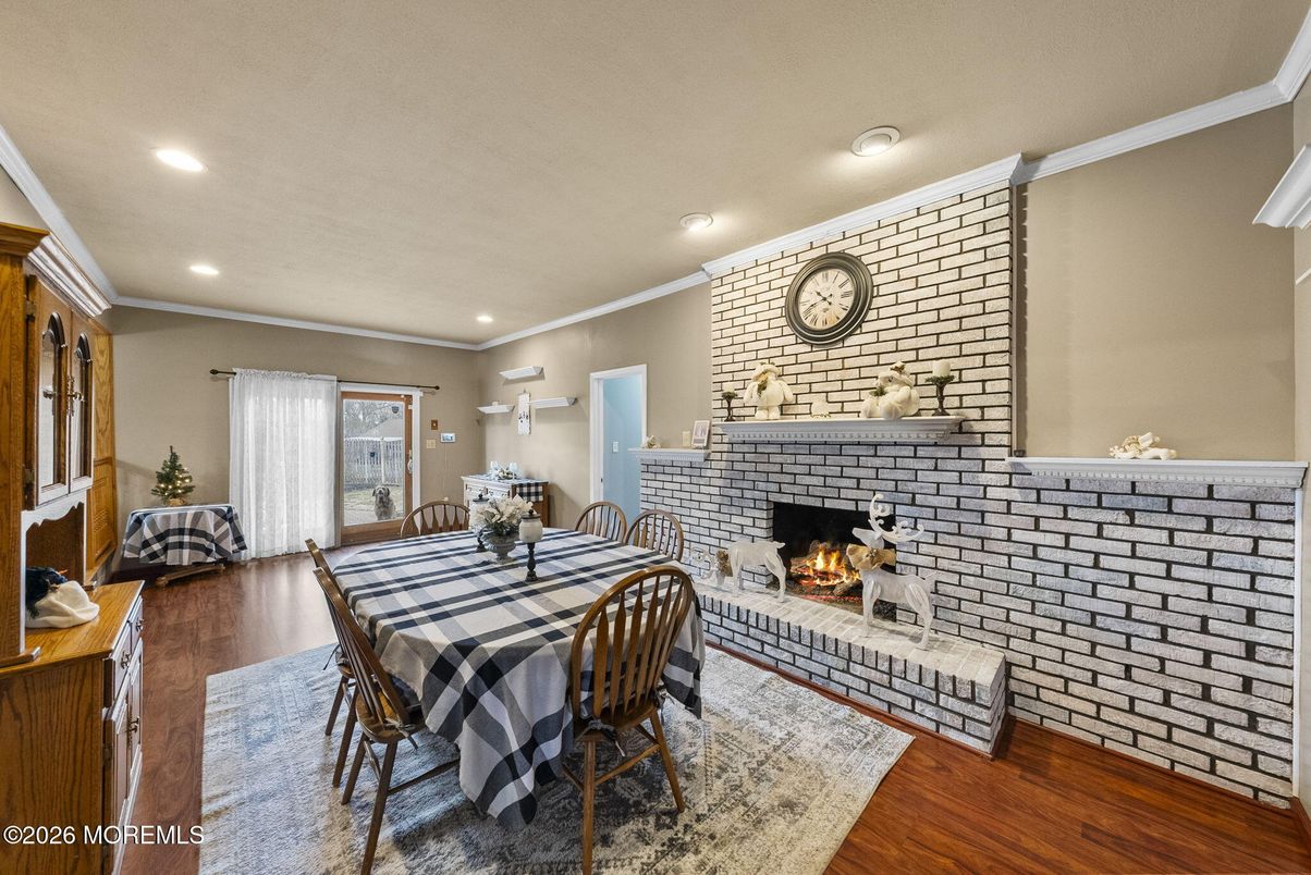 Dining room, Fireplace, Interior, Recessed Lighting, Stone Walls, Wood Texture Flooring