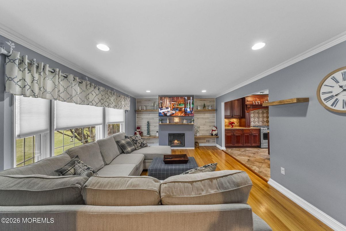 Fireplace, Interior, Living room, Recessed Lighting, Stone Walls, Wood Texture Flooring