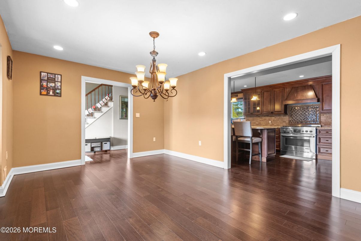 Chandelier, Dining room, Interior, Kitchen, Pendant Lights, Recessed Lighting, Stainless Steel Appliances, Wood Texture Flooring