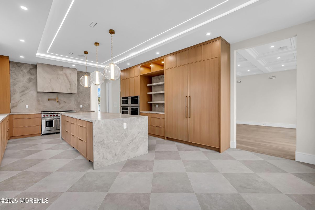 Interior, Kitchen, Marble Walls, Pendant Lights, Recessed Lighting, Stainless Steel Appliances