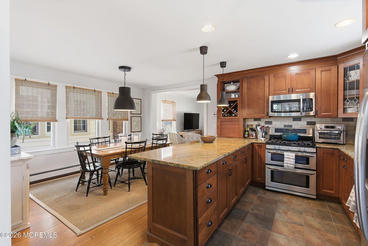 Dining room, Interior, Kitchen, Pendant Lights, Recessed Lighting, Stainless Steel Appliances, Wood Texture Flooring