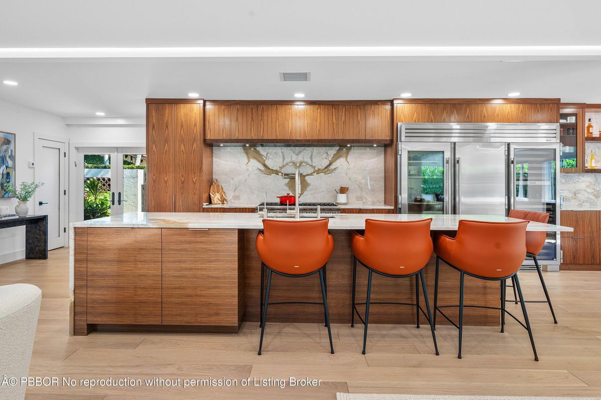 Interior, Kitchen, Marble Walls, Recessed Lighting, Stainless Steel Appliances, Wood Texture Flooring