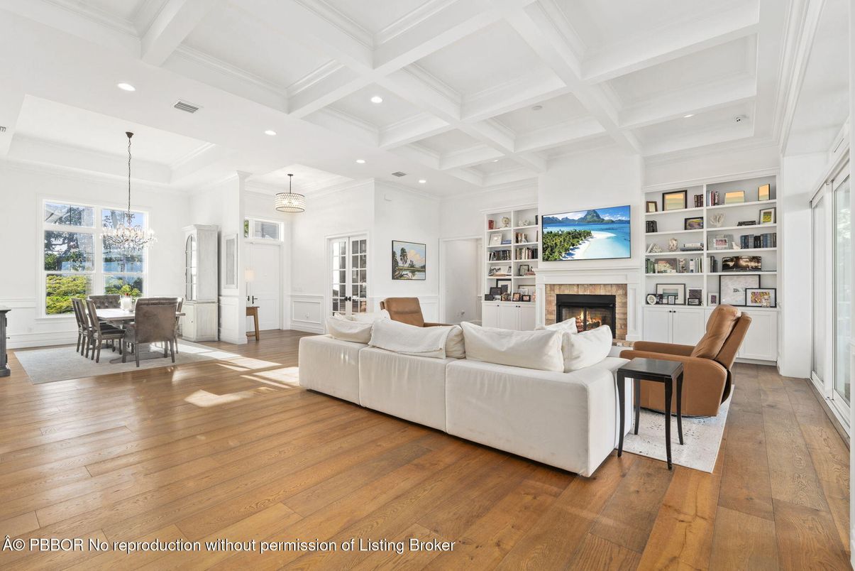 Chandelier, Dining room, Fireplace, Interior, Living room, Pendant Lights, Recessed Lighting, Wood Texture Flooring