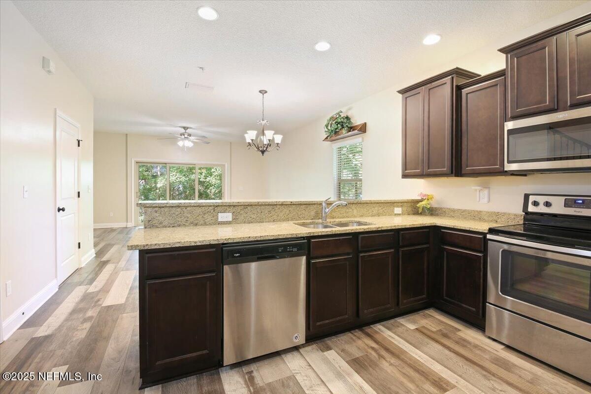 Chandelier, Interior, Kitchen, Recessed Lighting, Stainless Steel Appliances, Wood Texture Flooring