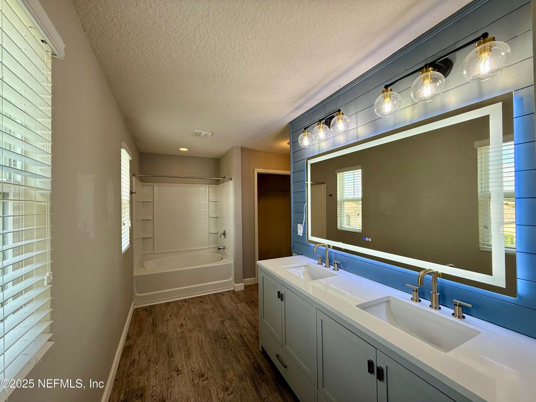 Bathroom, Dual Sink Vanities, Glass Shower, Interior, Recessed Lighting, Wood Texture Flooring