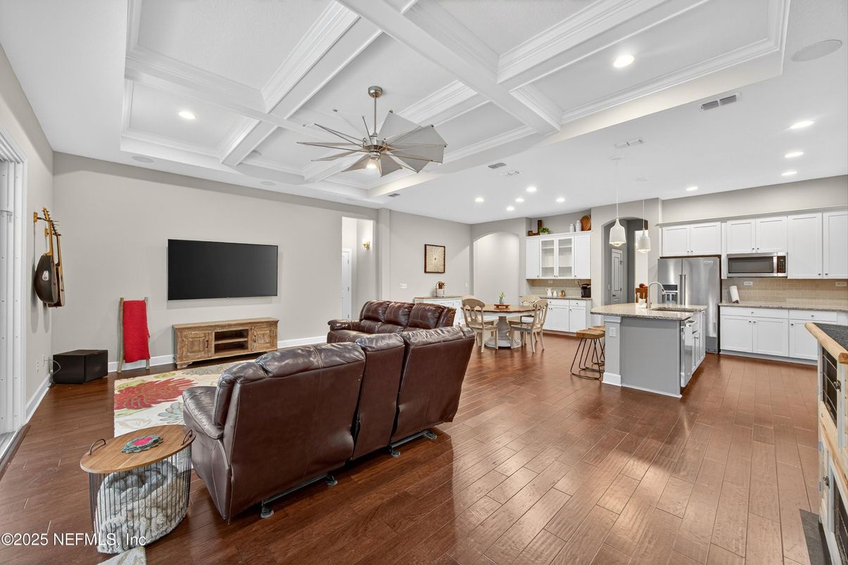 Dining room, Fireplace, Interior, Kitchen, Living room, Pendant Lights, Recessed Lighting, Stainless Steel Appliances, Wood Texture Flooring