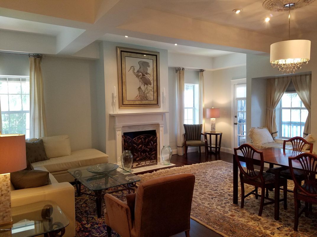 Chandelier, Dining room, Fireplace, Interior, Living room, Pendant Lights, Recessed Lighting, Wood Texture Flooring