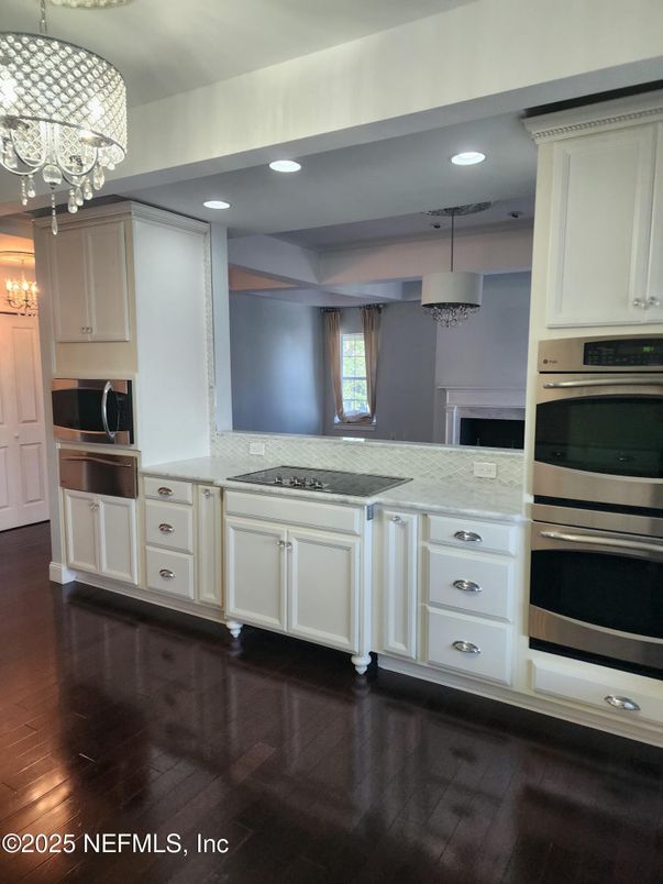 Chandelier, Interior, Kitchen, Pendant Lights, Recessed Lighting, Stainless Steel Appliances, Wood Texture Flooring