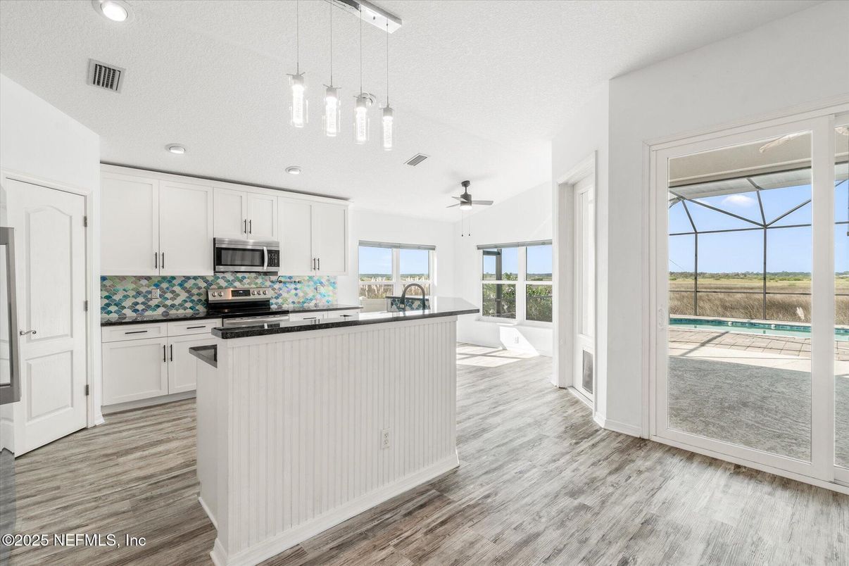 Glass Ceilings, Interior, Kitchen, Pendant Lights, Recessed Lighting, Stainless Steel Appliances, Sun Room, Wood Texture Flooring