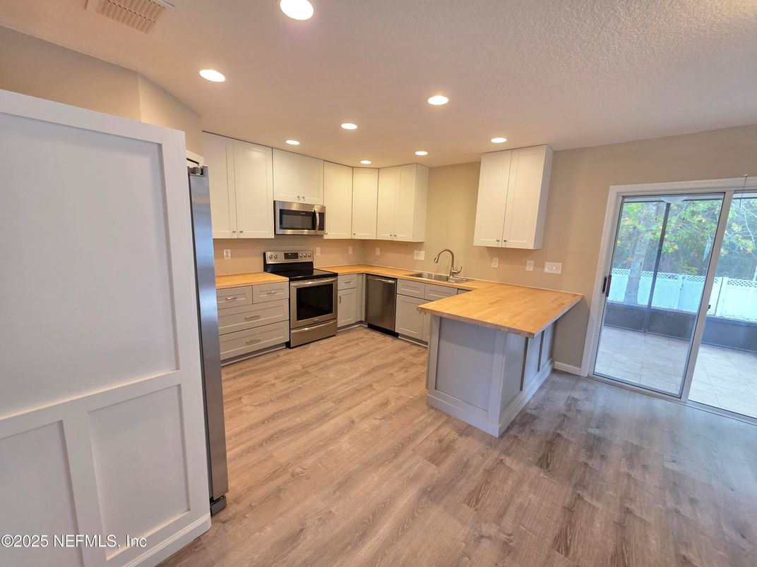 Interior, Kitchen, Recessed Lighting, Stainless Steel Appliances, Wood Texture Flooring