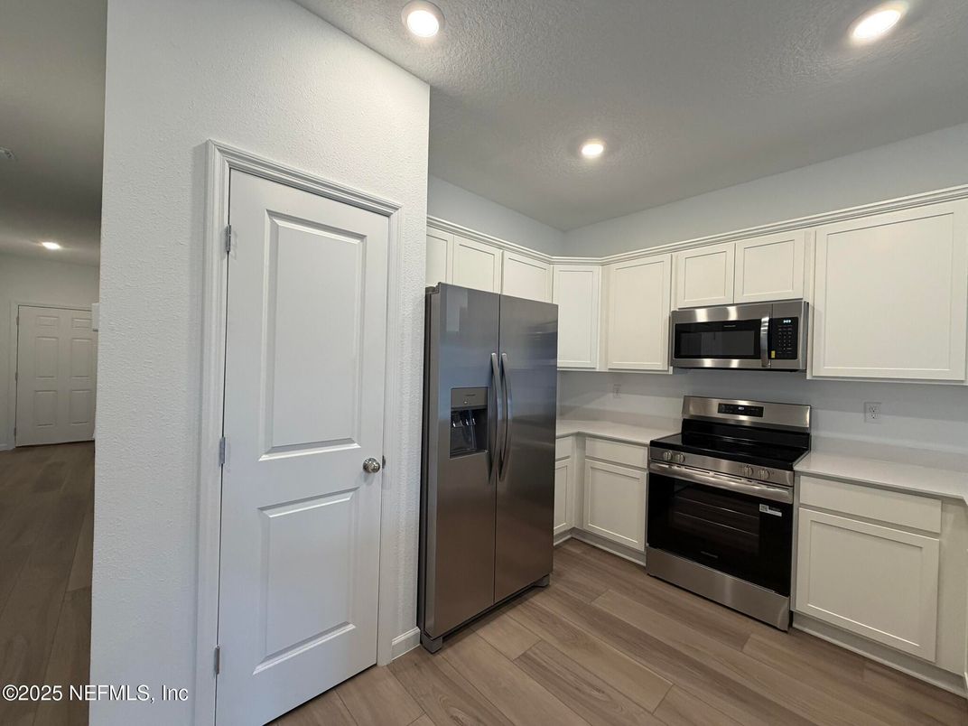 Interior, Kitchen, Recessed Lighting, Stainless Steel Appliances, Wood Texture Flooring