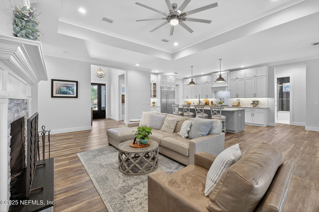 Fireplace, Interior, Kitchen, Living room, Pendant Lights, Recessed Lighting, Stainless Steel Appliances, Wood Texture Flooring