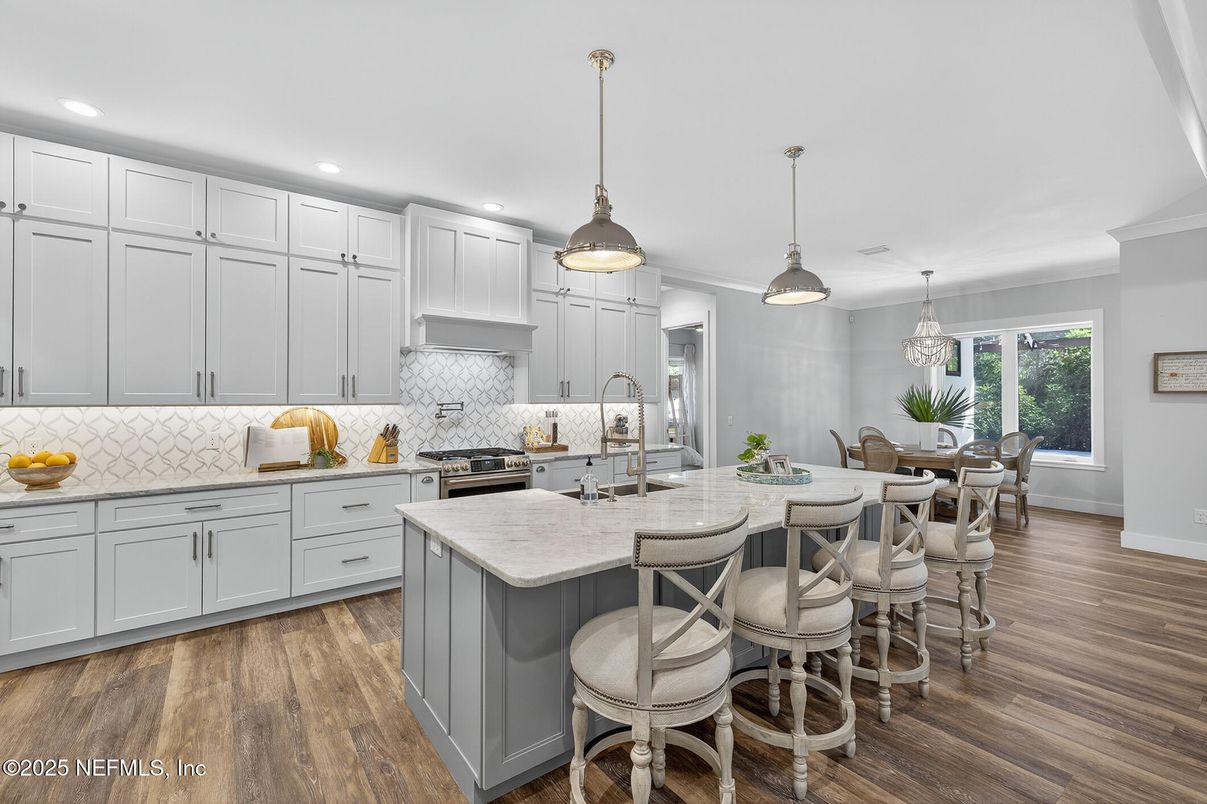 Dining room, Interior, Kitchen, Pendant Lights, Recessed Lighting, Stainless Steel Appliances, Wood Texture Flooring