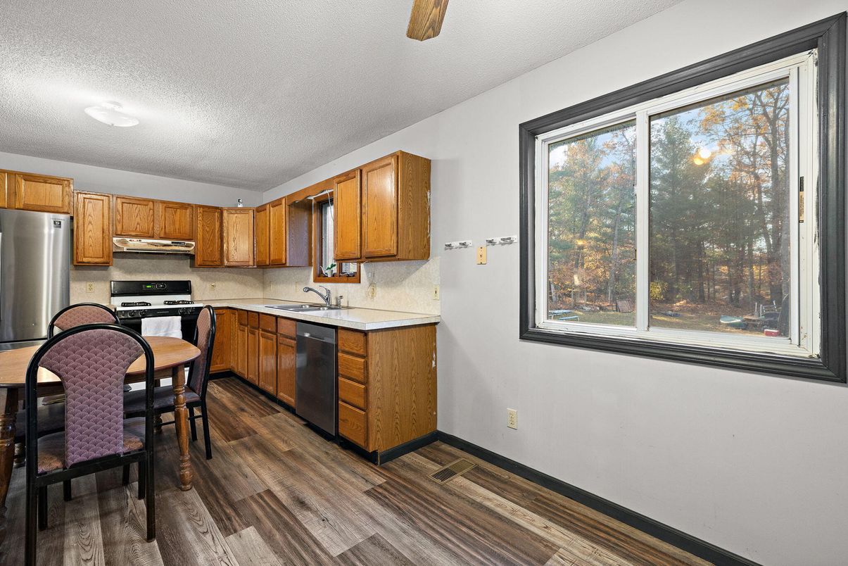 Dining room, Interior, Kitchen, Recessed Lighting, Stainless Steel Appliances, Wood Texture Flooring