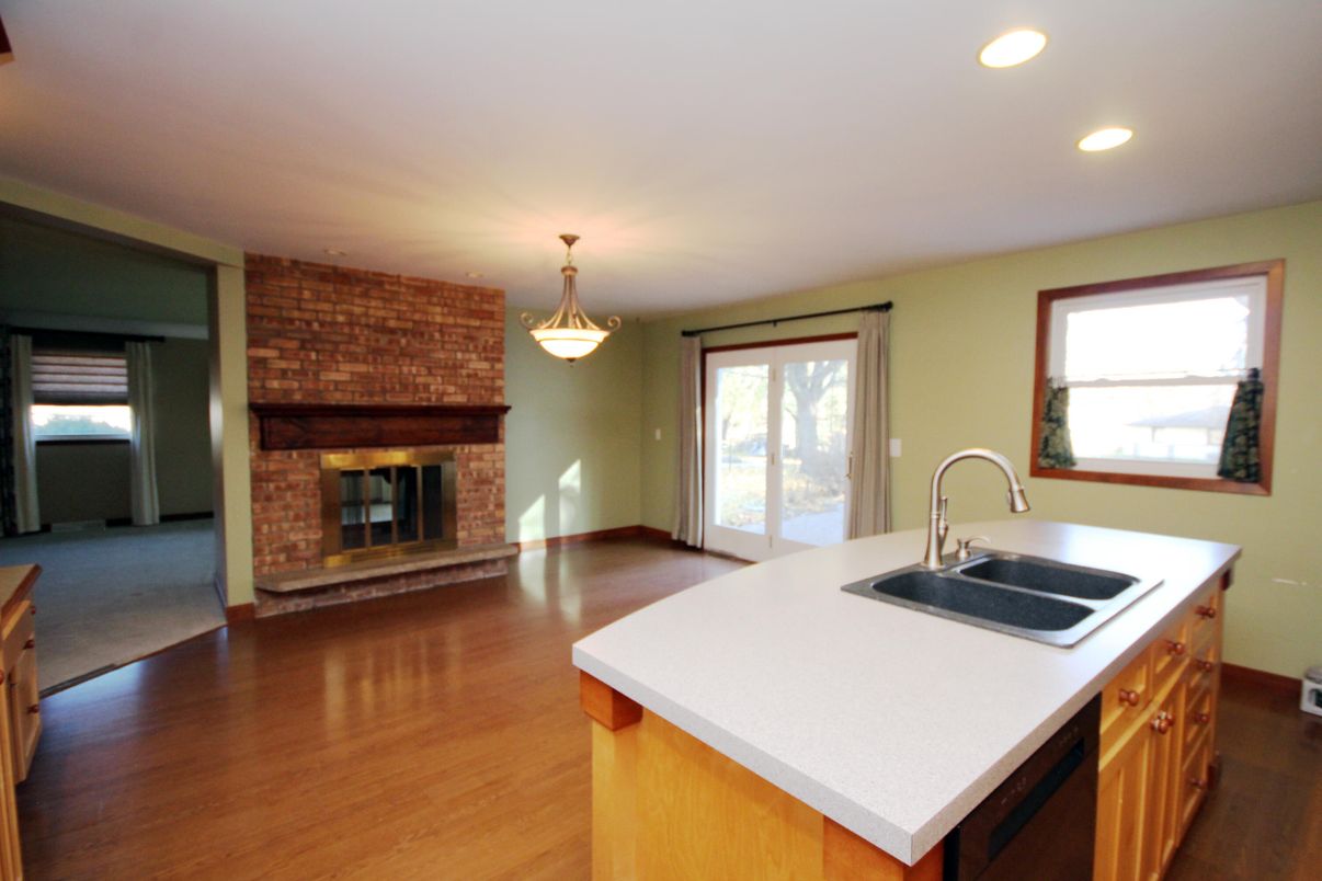 Fireplace, Interior, Kitchen, Pendant Lights, Recessed Lighting, Stone Walls, Wood Texture Flooring
