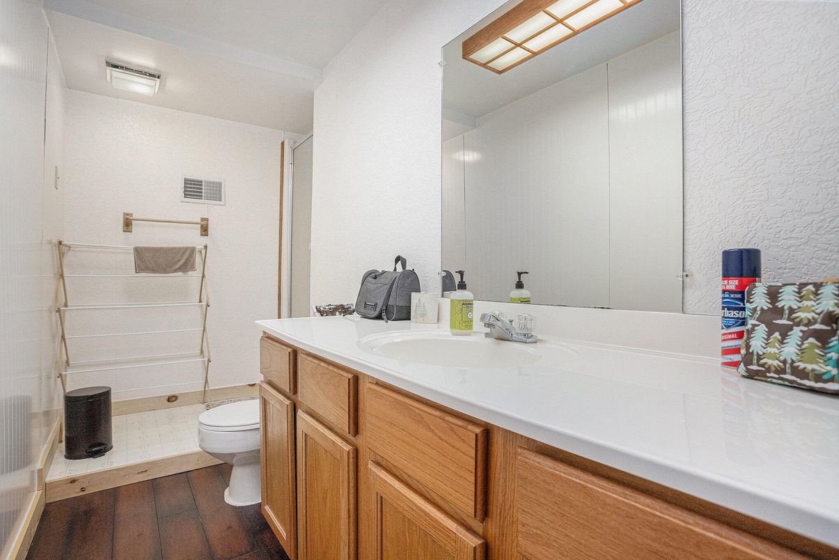 Bathroom, Dual Sink Vanities, Glass Shower, Interior, Wood Texture Flooring