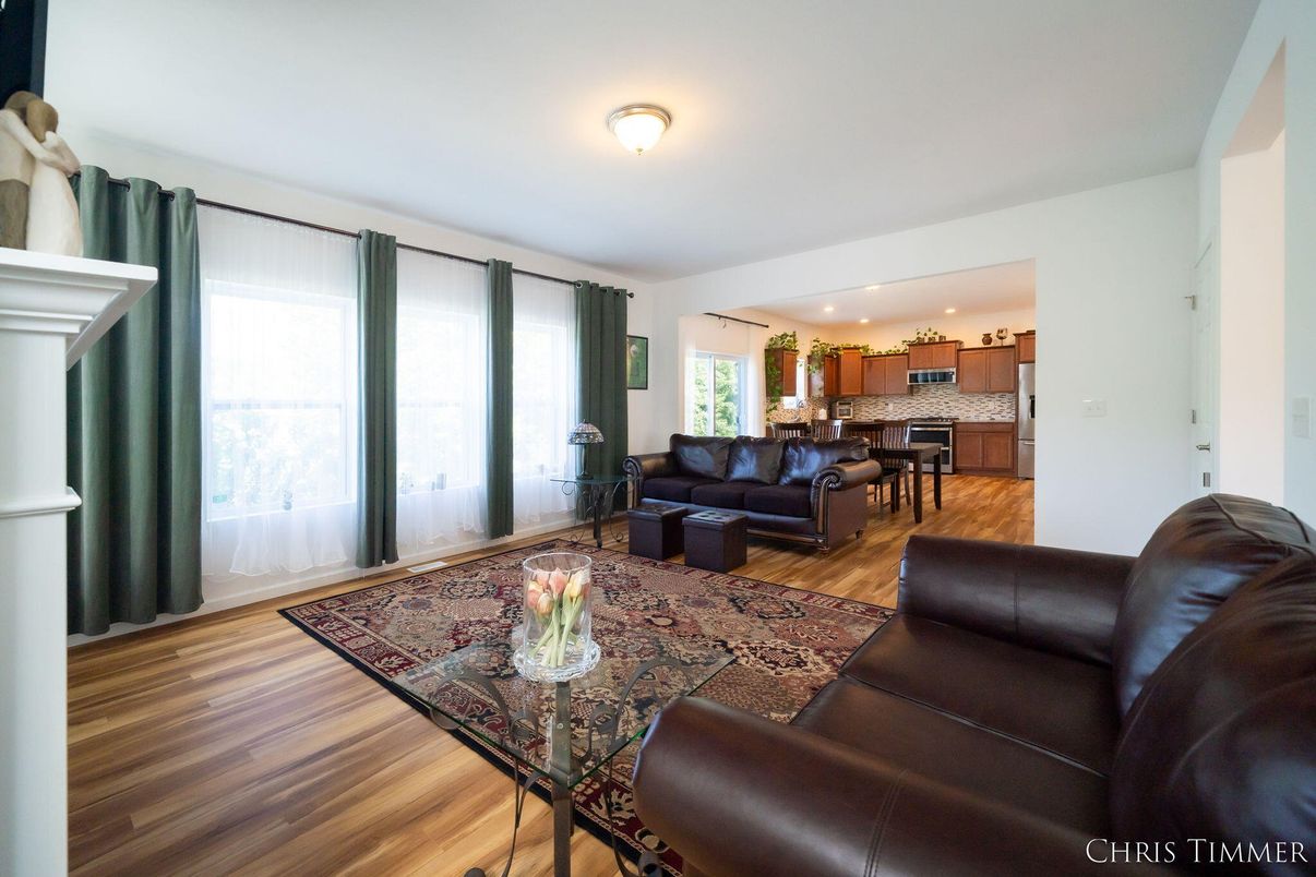 Fireplace, Interior, Kitchen, Living room, Recessed Lighting, Stainless Steel Appliances, Wood Texture Flooring