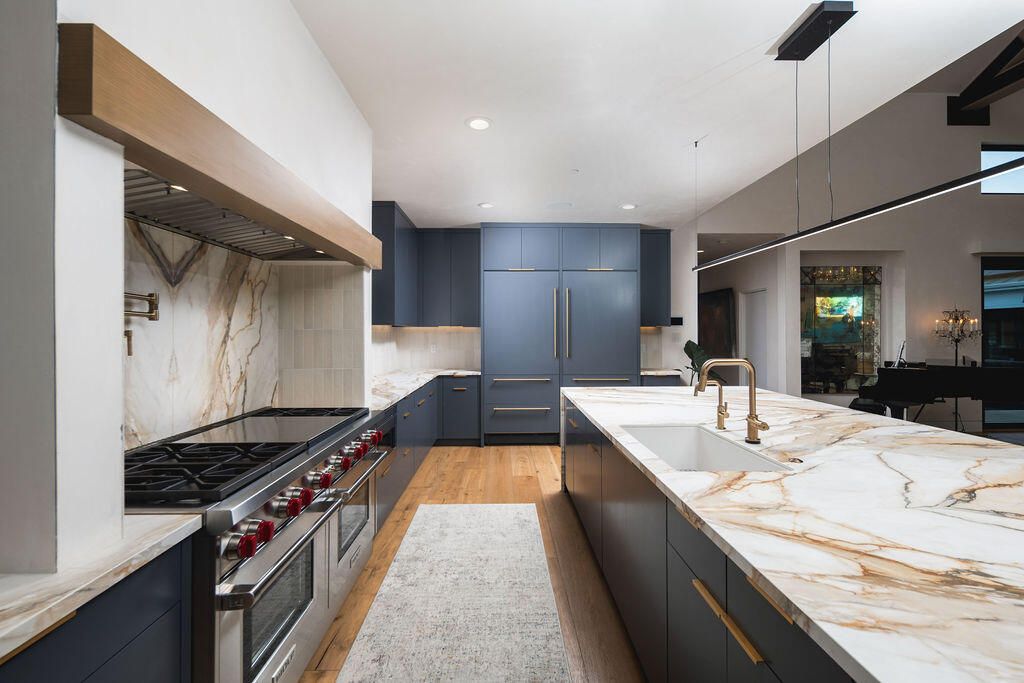 Interior, Kitchen, Marble Walls, Pendant Lights, Recessed Lighting, Stainless Steel Appliances, Wood Texture Flooring