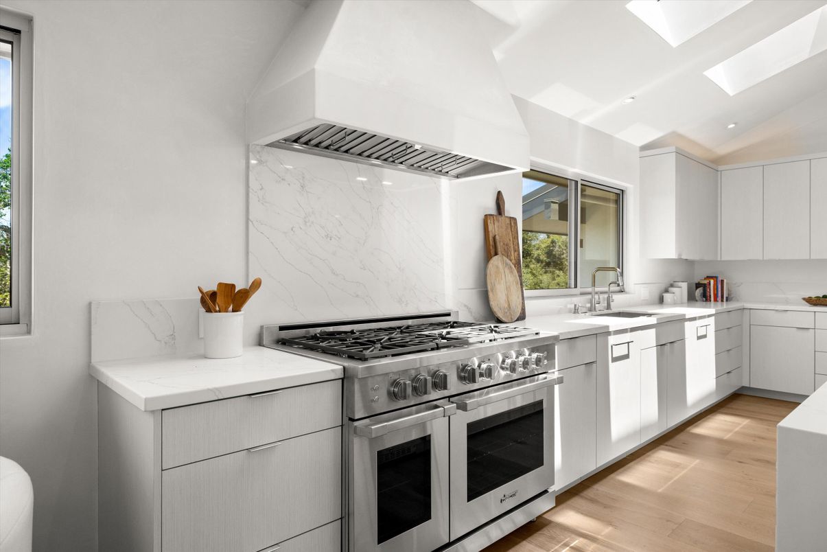 Interior, Kitchen, Marble Walls, Recessed Lighting, Stainless Steel Appliances, Wood Texture Flooring