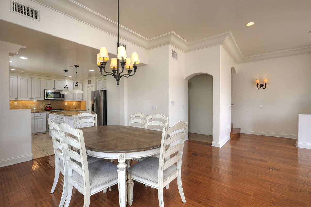 Chandelier, Dining room, Interior, Kitchen, Pendant Lights, Recessed Lighting, Stainless Steel Appliances, Wood Texture Flooring