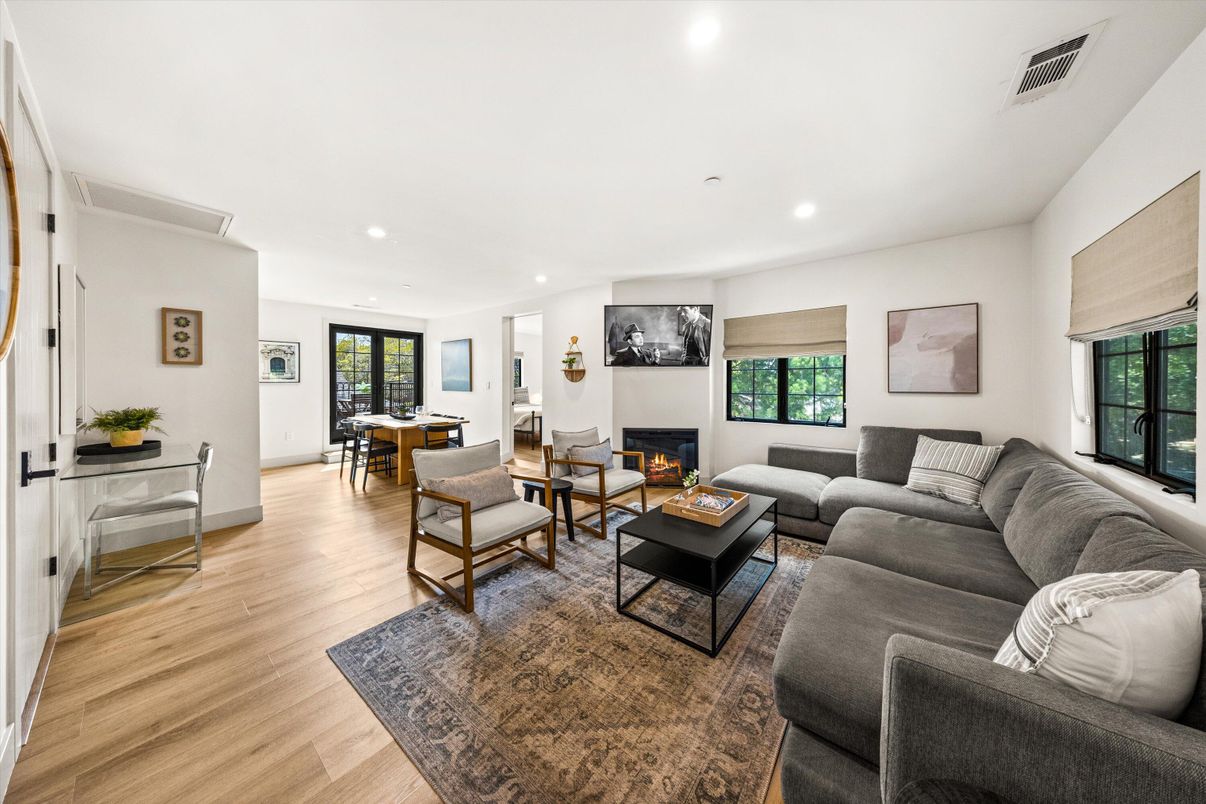 Dining room, Fireplace, Interior, Living room, Recessed Lighting, Wood Texture Flooring