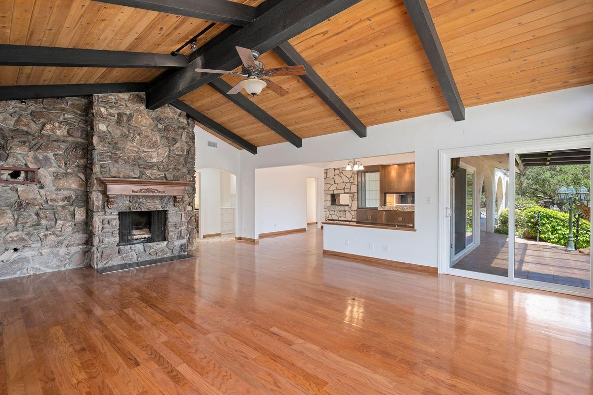 Empty room, Fireplace, Interior, Pendant Lights, Stone Walls, Wooden Beams, Wooden Ceilings, Wood Texture Flooring