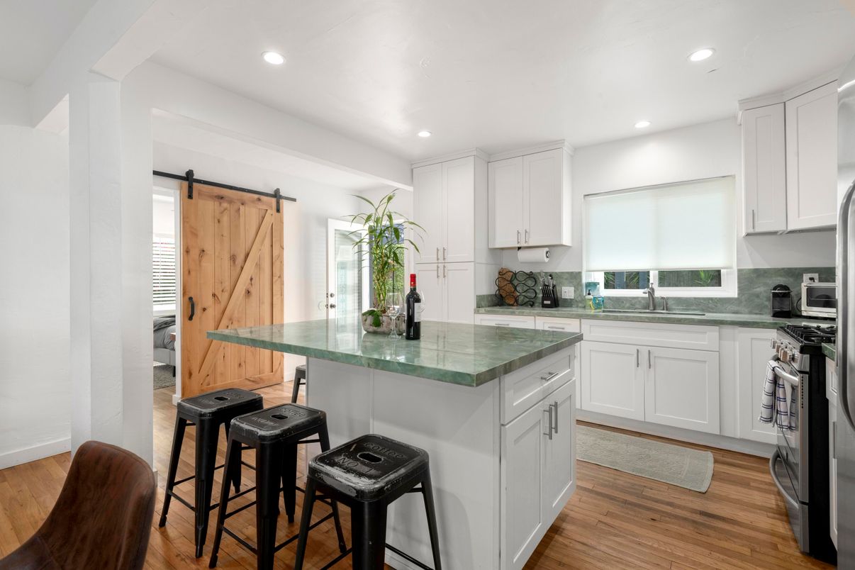 Interior, Kitchen, Recessed Lighting, Tile Countertops, Wood Texture Flooring