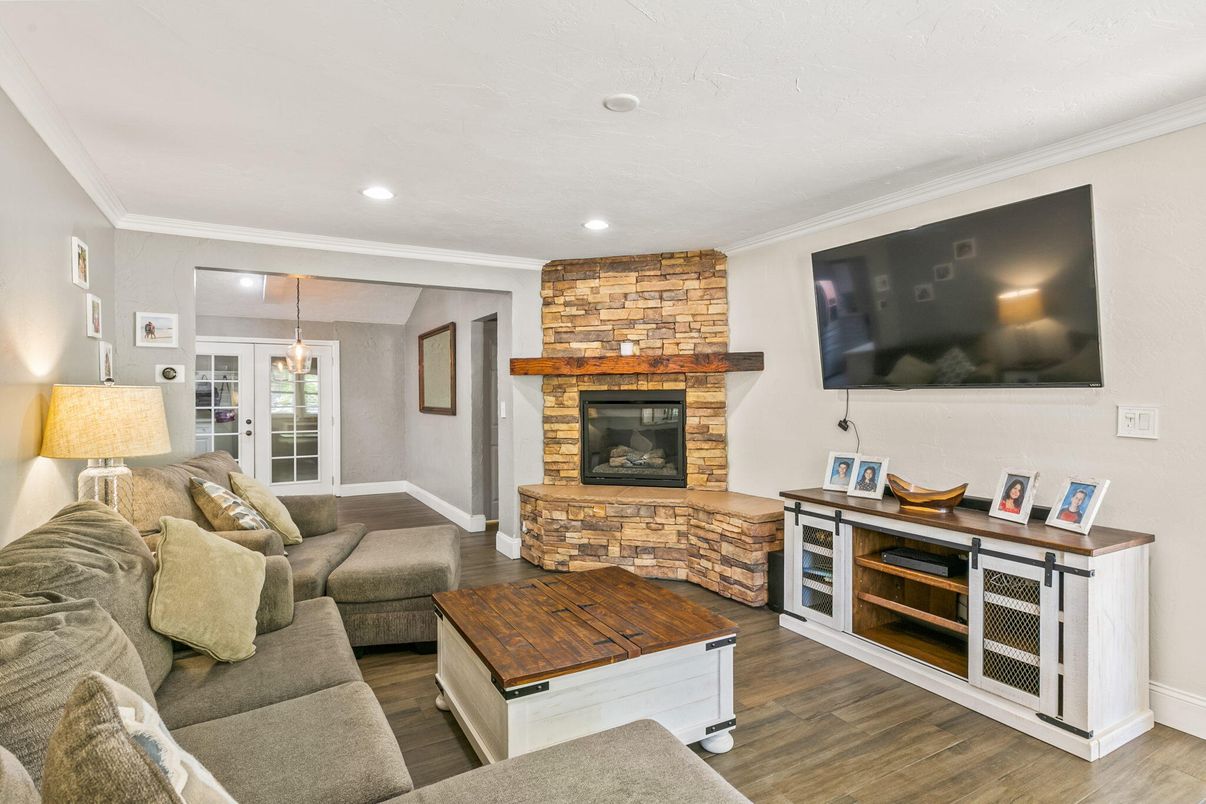 Fireplace, Interior, Living room, Recessed Lighting, Stone Walls, Wood Texture Flooring