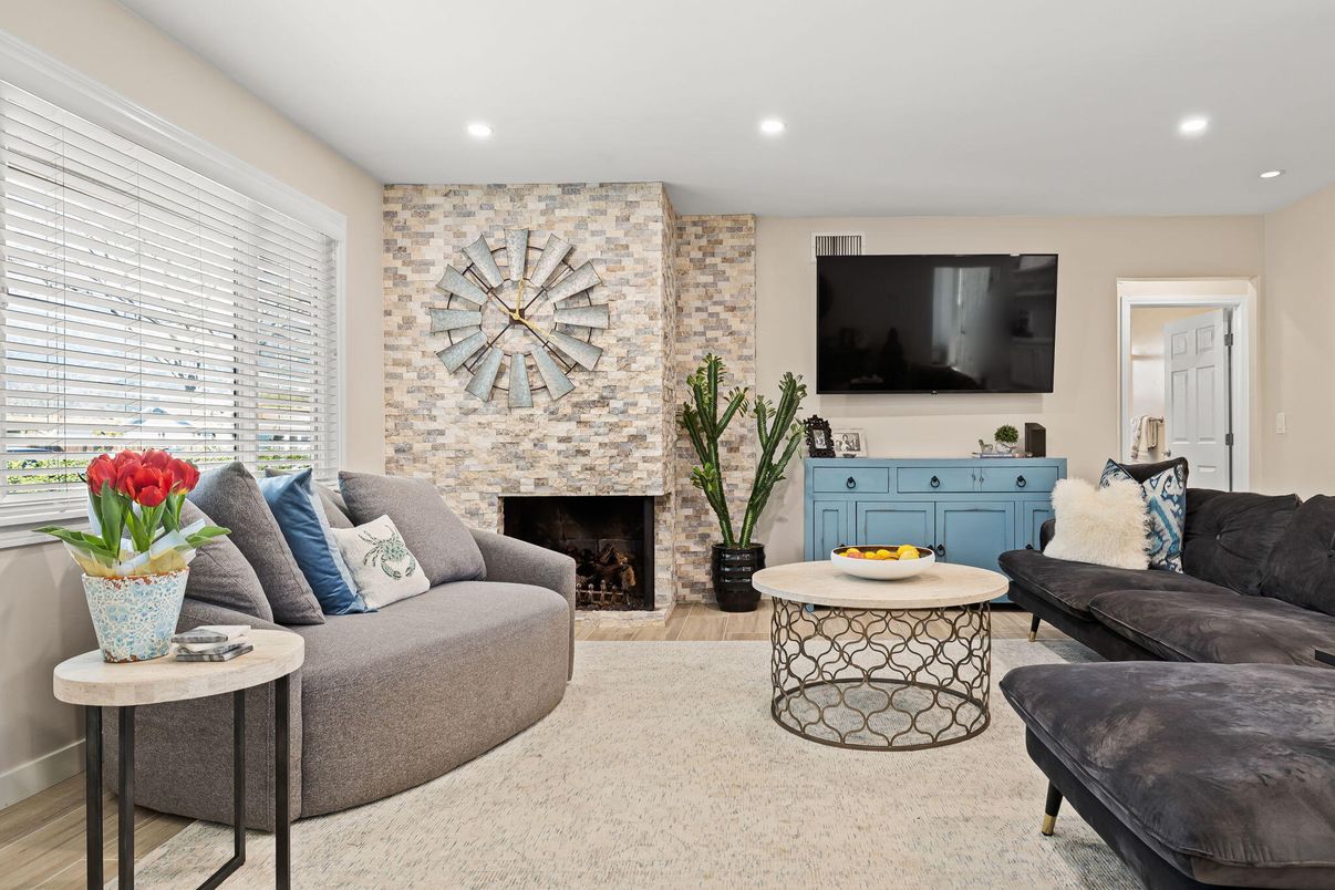 Fireplace, Interior, Living room, Recessed Lighting, Stone Walls, Wood Texture Flooring