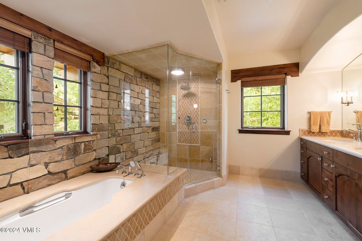 Bathroom, Dual Sink Vanities, Glass Shower, Interior, Recessed Lighting, Stone Walls