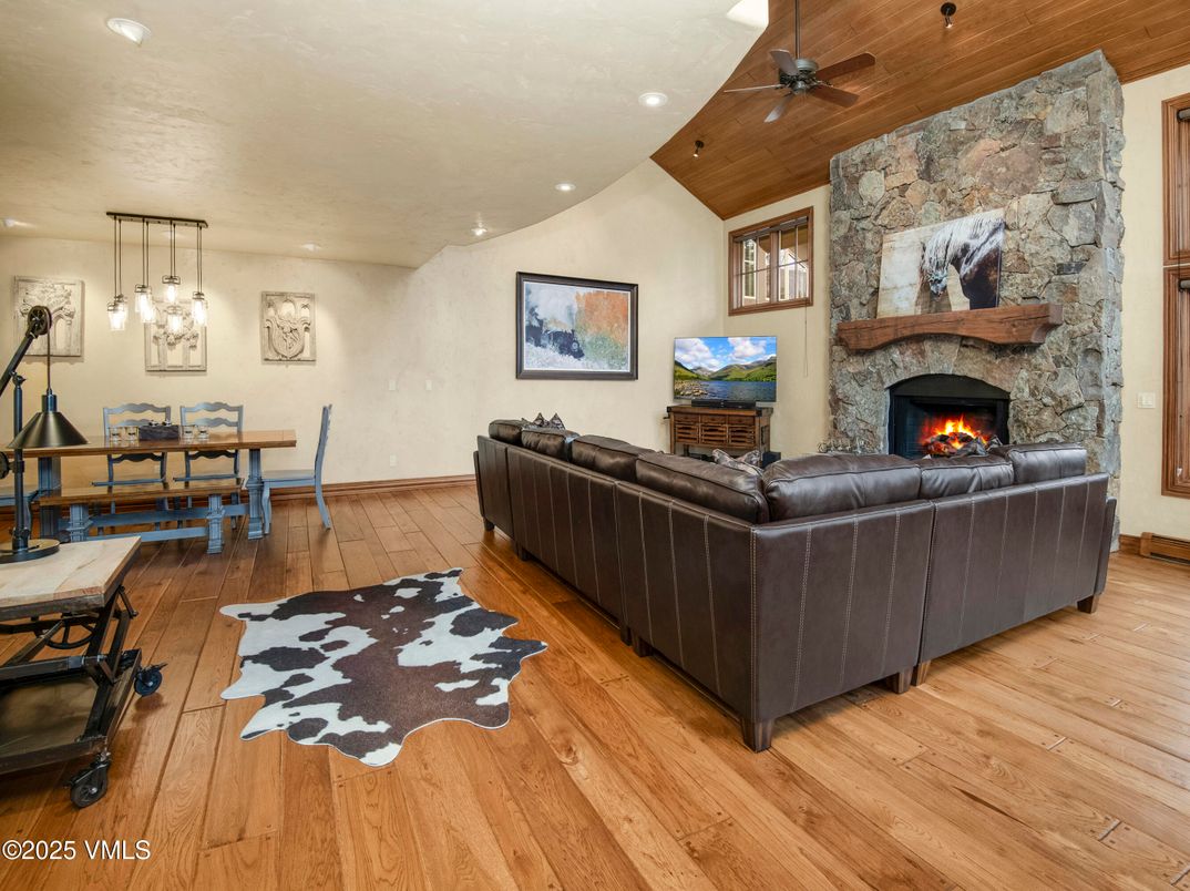 Dining room, Fireplace, Interior, Living room, Pendant Lights, Recessed Lighting, Stone Walls, Wood Texture Flooring