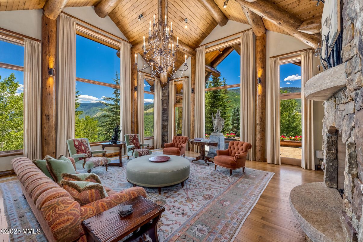 Chandelier, Fireplace, Interior, Living room, Stone Walls, Sun Room, Wooden Beams, Wooden Ceilings, Wood Texture Flooring