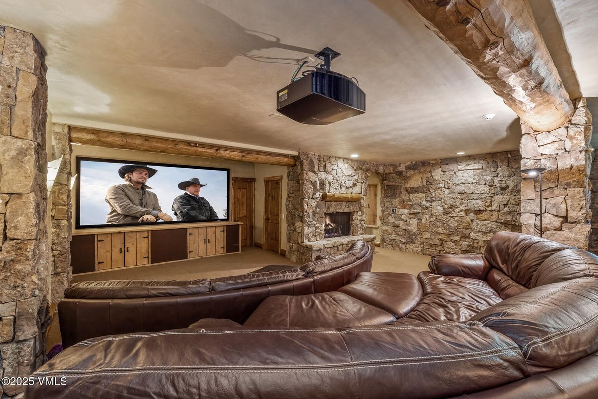 Fireplace, Interior, Projection Screen, Recessed Lighting, Stone Walls